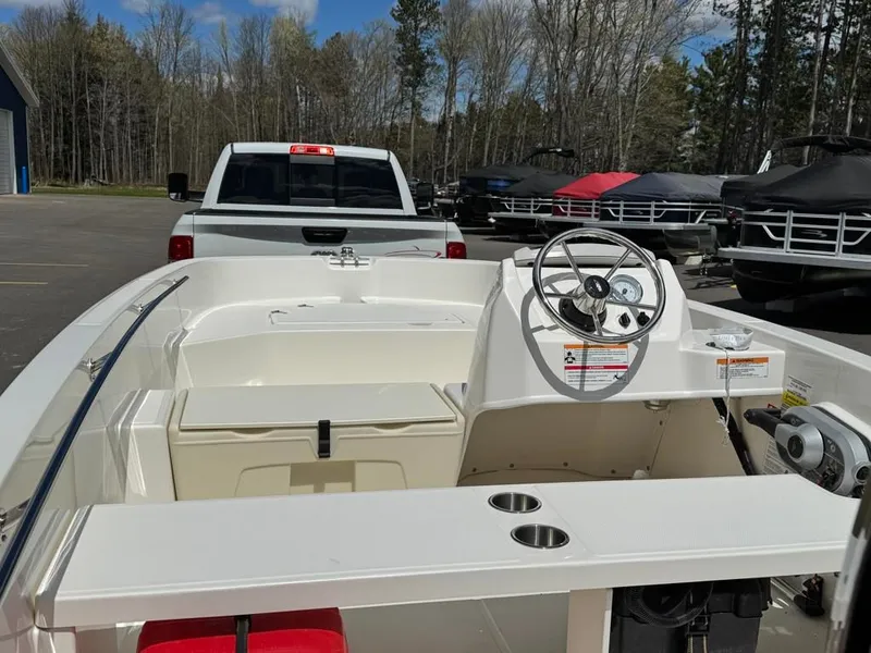 Slide: The Image of Boston Whaler 160 Super Sport 2026 on trailer behind a truck. - 10