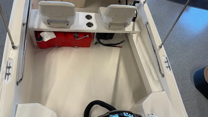Slide: The Image of Interior of 2026 Boston Whaler 160 Super Sport with seating and storage. - 10