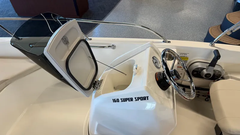 Slide: The Image of Interior view of the 2026 Boston Whaler 160 Super Sport boat. - 11