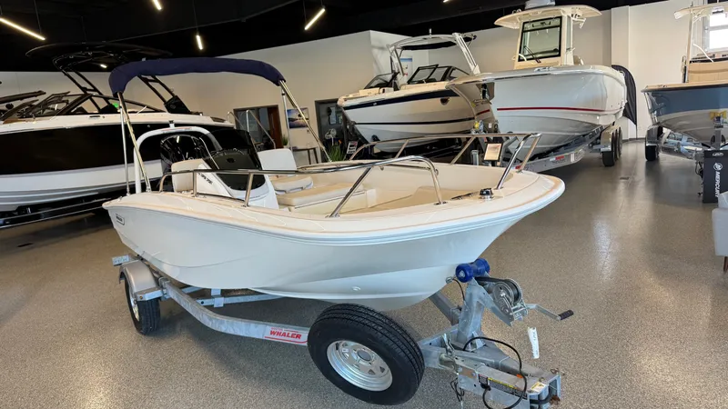 Slide: The Image of 2026 Boston Whaler 160 Super Sport in showroom on trailer. - 12