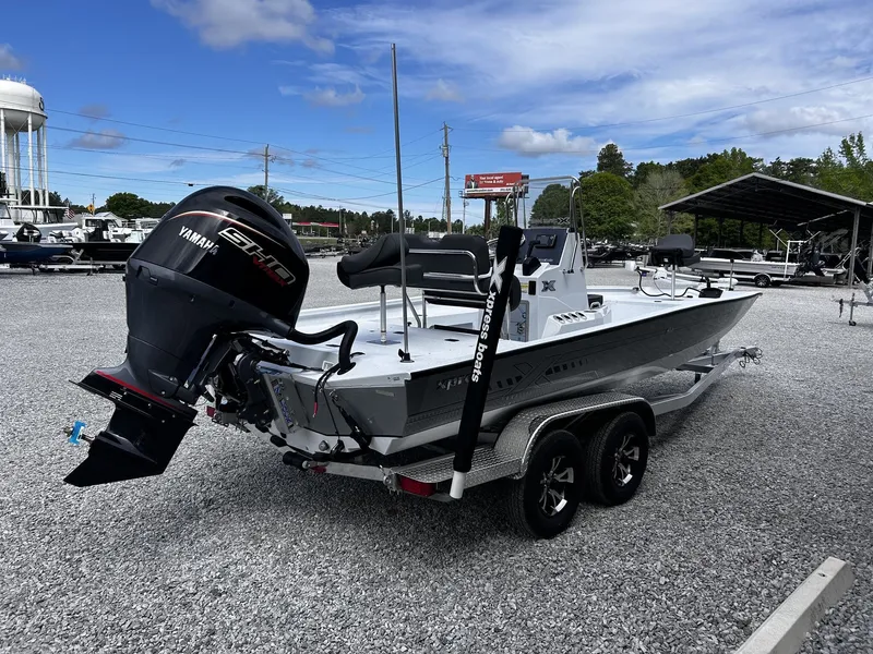 Slide: The Image of 2026 Xpress H22B Bay boat with Yamaha engine on trailer. - 4