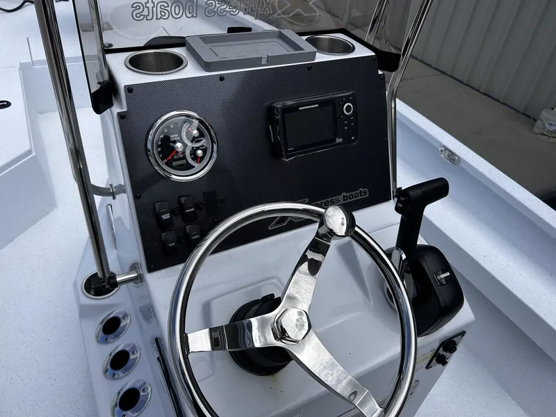 Slide: The Image of Steering console of Xpress H22B Bay boat, model year 2026. - 6