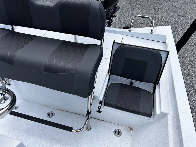 Slide: The Image of Interior of 2026 Xpress H22B Bay with black seating. - 7