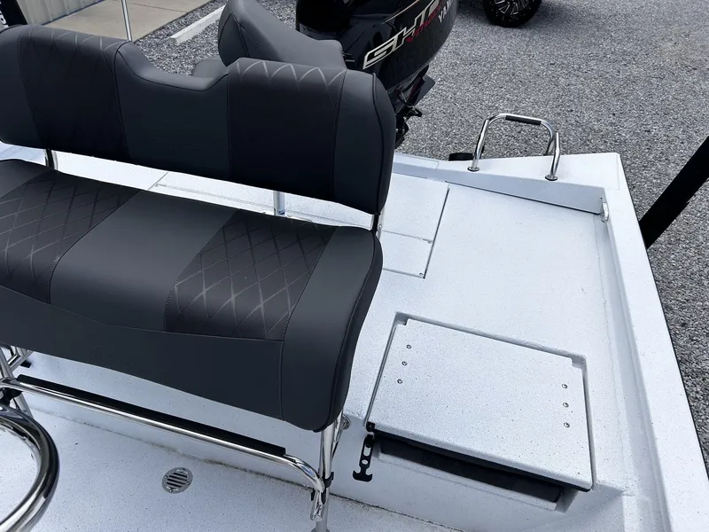 Slide: The Image of 2026 Xpress H22B Bay boat with cushioned seats and storage area. - 8