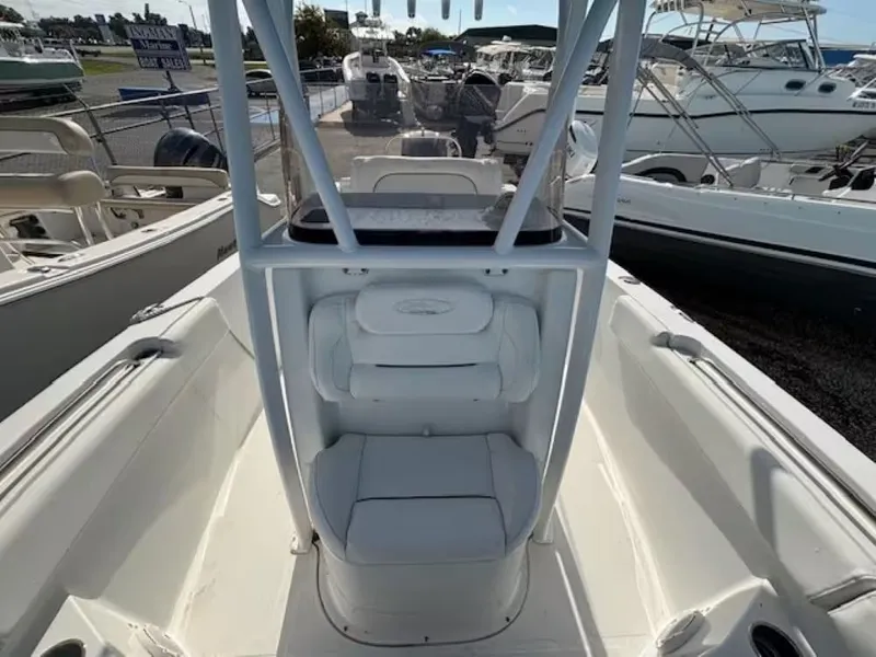 Slide: The Image of Interior view of a 2016 Sea Hunt 234 Ultra boat in the marina. - 9