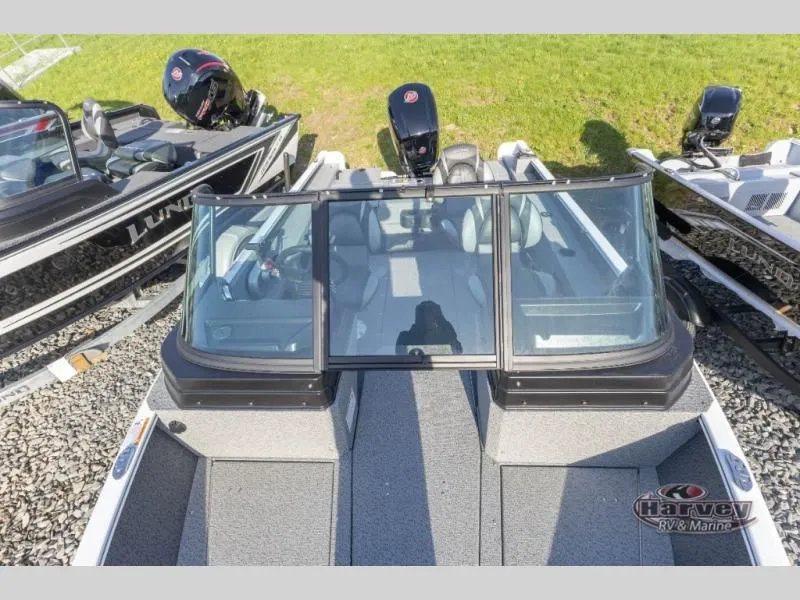 Slide: The Image of Adventure 1775 Sport 2026 boat on gravel lot at Harvey RV & Marine. - 6