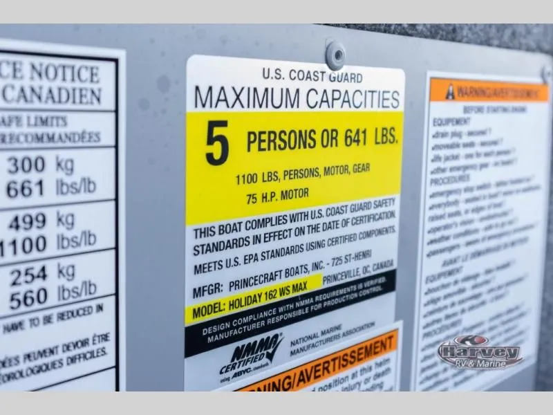 Slide: The Image of Boat capacity label for 5 persons or 641 lbs, model Holiday 162 WS MAX. - 15