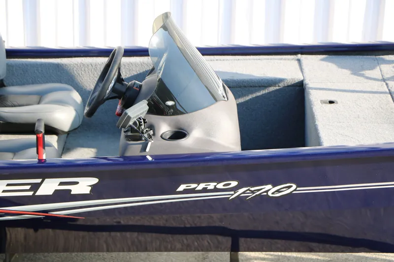 Slide: The Image of 2019 Tracker Pro 170 boat cockpit and controls. - 12