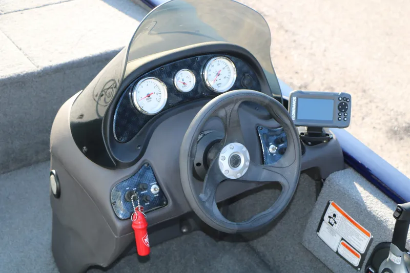Slide: The Image of 2019 Tracker Pro 170 boat dashboard with gauges and GPS. - 16