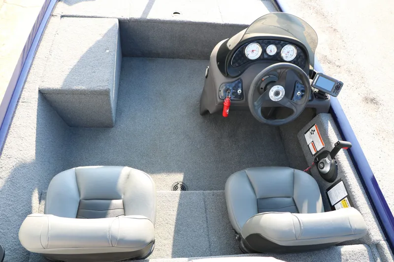 Slide: The Image of Interior of a 2019 Tracker Pro 170 boat with steering console. - 17