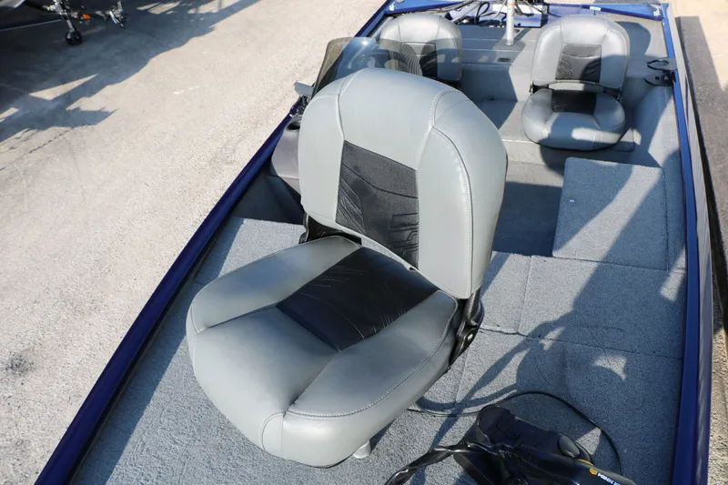 Slide: The Image of Interior of a 2019 Tracker Pro 170 boat with gray seats. - 18