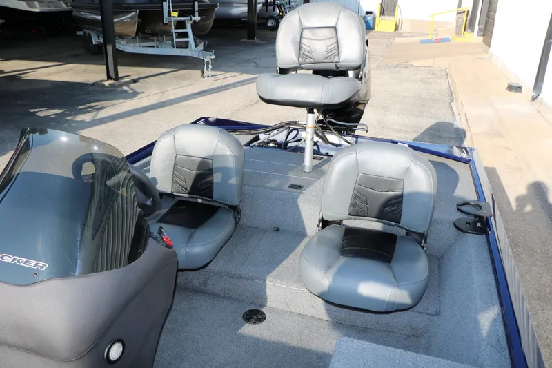 Slide: The Image of 2019 Tracker Pro 170 boat with gray seats outdoors. - 20