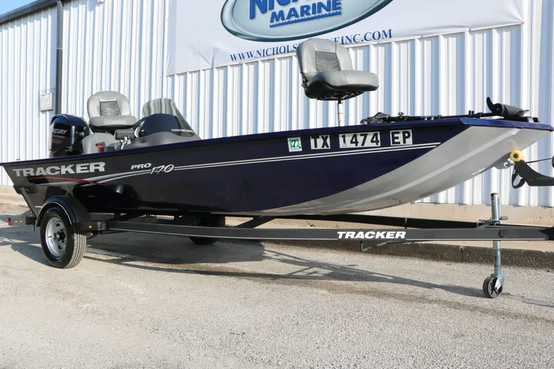 Slide: The Image of 2019 Tracker Pro 170 boat on trailer in front of building. - 3