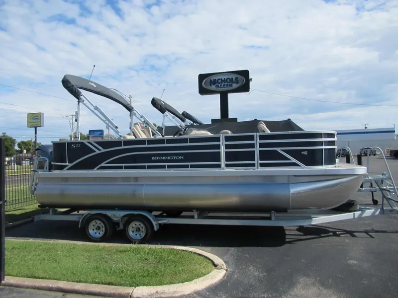 Slide: The Image of Bennington 22 SF 2026 parked outdoors on a trailer. - 9
