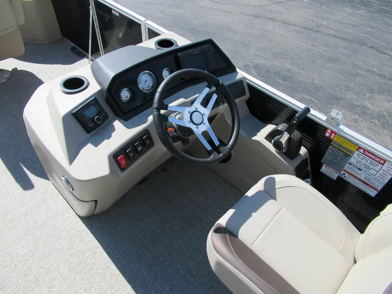 Slide: The Image of Helm of a Bennington 22 SF with steering wheel and instruments. - 4