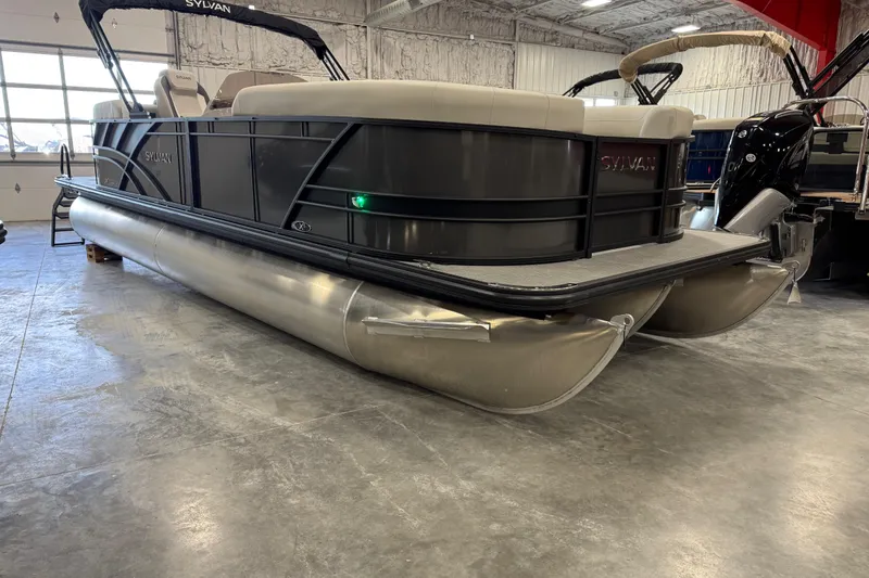 The Image of 2026 Sylvan Mirage X X5 pontoon boat in showroom, showcasing sleek design and modern features. - 1