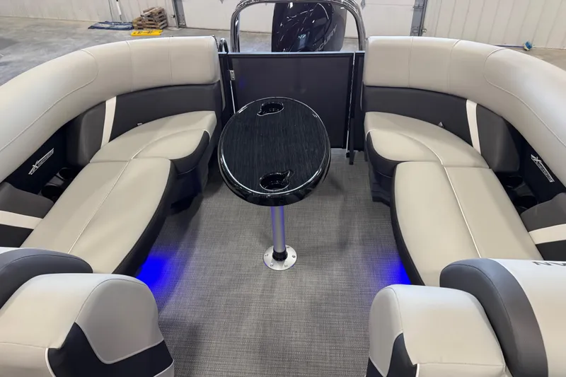 Slide: The Image of Luxurious interior of 2026 Sylvan Mirage X X5 pontoon boat with elegant seating and table. - 8