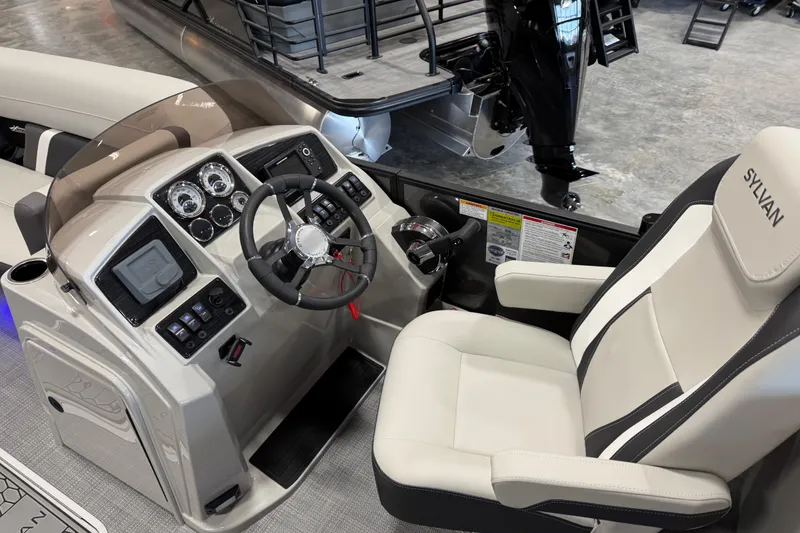 Slide: The Image of Interior view of 2026 Sylvan Mirage X X5 boat cockpit with modern controls and steering. - 9