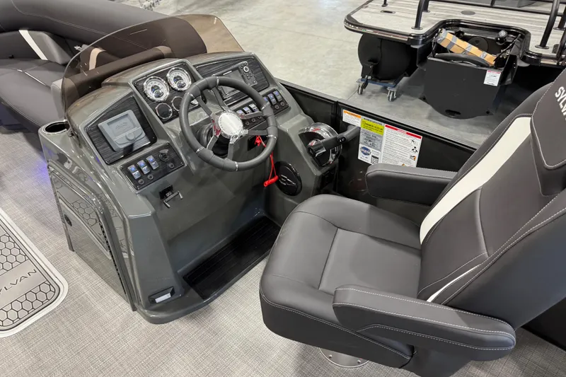 Slide: The Image of 2026 Sylvan X5 boat cockpit with modern controls and comfortable seating. - 10