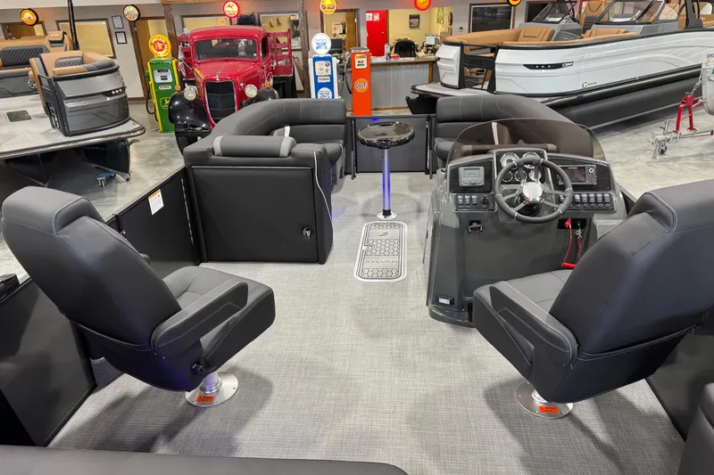 Slide: The Image of Interior of 2026 Sylvan X5 boat with modern seating and control panel. - 11