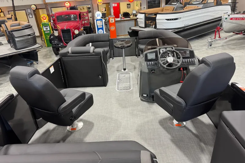Slide: The Image of Interior of a 2026 Sylvan X5 boat with modern seating and control panel. - 12