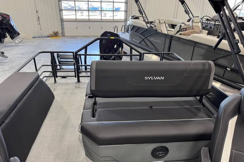 Slide: The Image of Interior view of 2026 Sylvan X5 boat with black seating and spacious layout. - 14