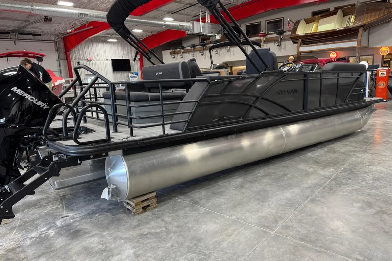 Slide: The Image of 2026 Sylvan X5 pontoon boat with Mercury engine in showroom. - 3