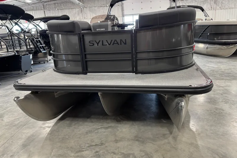 Slide: The Image of 2026 Sylvan X5 pontoon boat in showroom, rear view showcasing sleek design. - 5