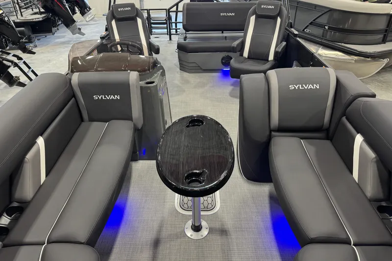 Slide: The Image of Interior of 2026 Sylvan X5 boat with modern seating and ambient lighting. - 7