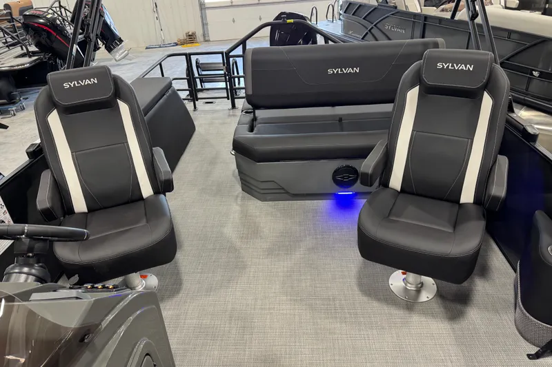 Slide: The Image of 2026 Sylvan X5 boat interior with black seating and modern design. - 8