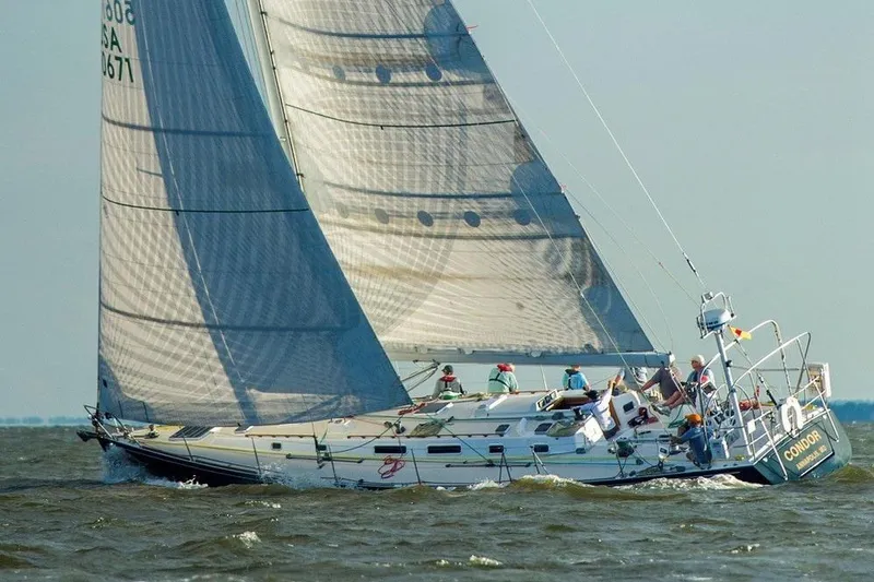 The Image of Sailing yacht J Boats J/160, 1996 model, navigating choppy waters with full sails. - 0