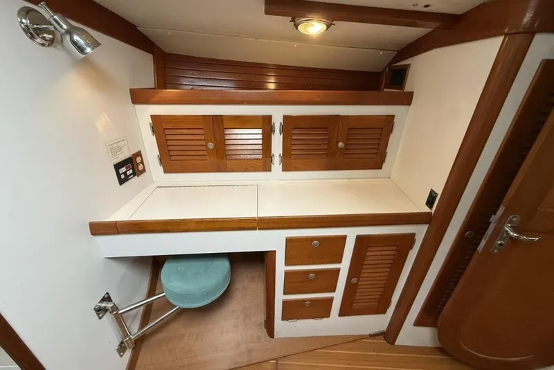 Slide: The Image of Interior of 1996 J Boats J/160 yacht with wooden cabinets and seating area. - 18