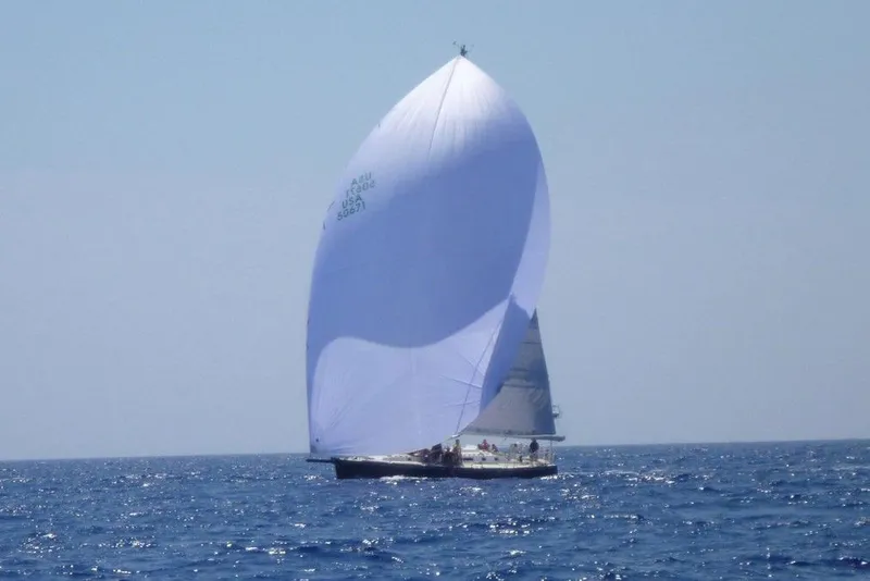 Slide: The Image of Sailing yacht J/160 from 1996 with large white spinnaker on open sea. - 25