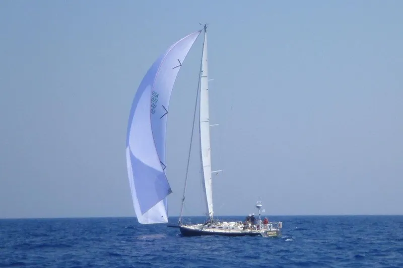 Slide: The Image of Sailing yacht J/160 from 1996 by J Boats, gliding on open sea with white spinnaker. - 26