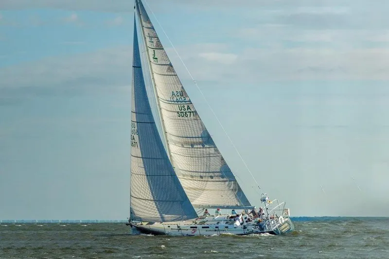 Slide: The Image of Sailing yacht J Boats J/160 from 1996 navigating open waters under full sail. - 27