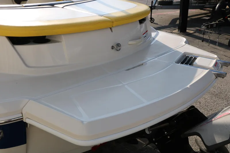 Slide: The Image of 2006 Sea Ray 185 Sport boat with yellow seating and swim platform. - 15