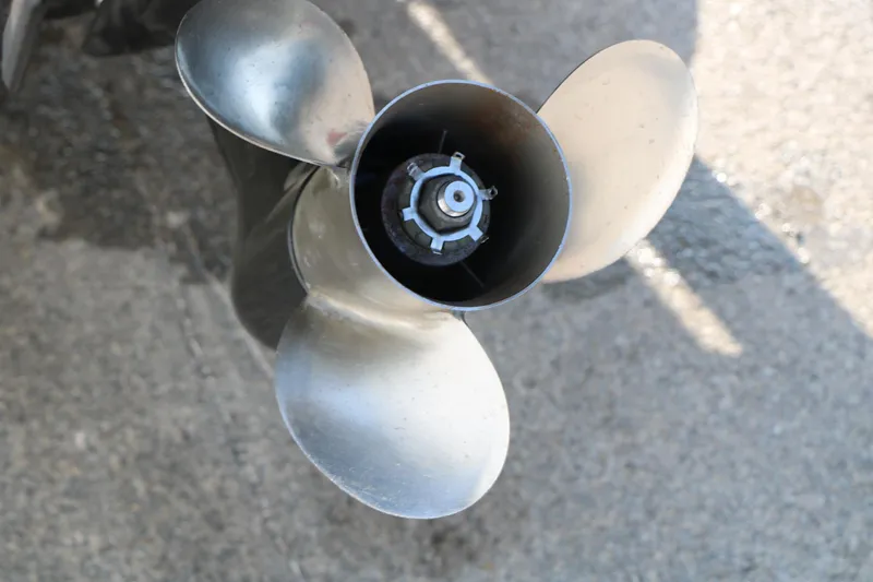Slide: The Image of Close-up of a 2006 Sea Ray 185 Sport boat propeller on a concrete surface. - 16