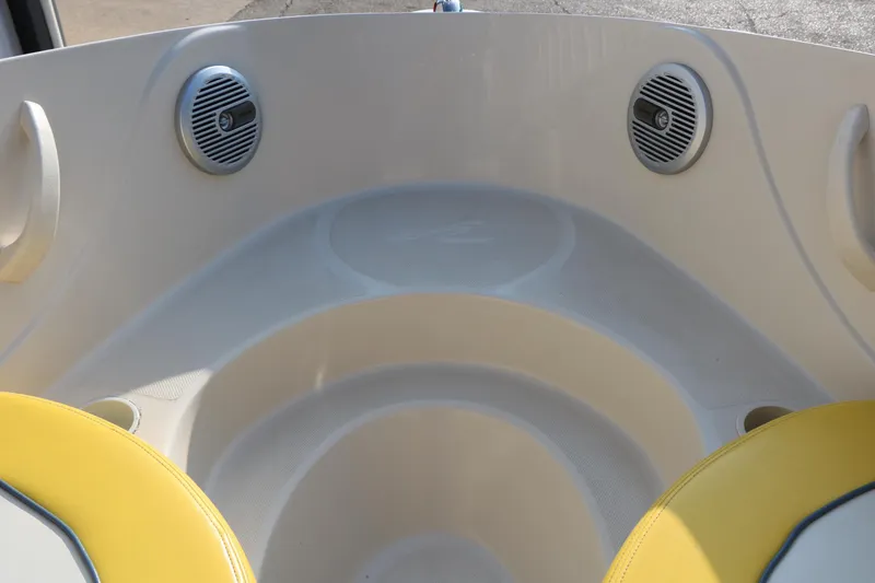 Slide: The Image of Interior of a 2006 Sea Ray 185 Sport boat with yellow seating and speakers. - 39