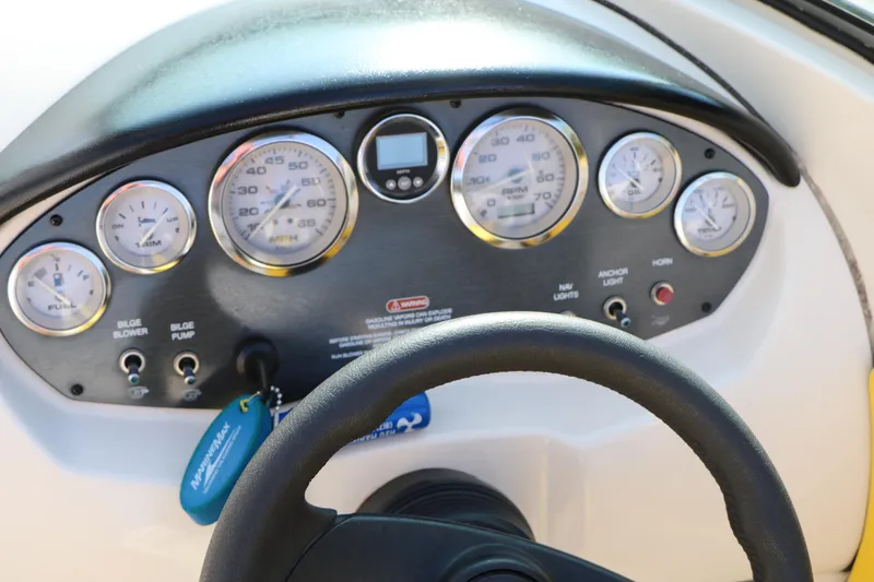 Slide: The Image of Dashboard of a 2006 Sea Ray 185 Sport boat with gauges and steering wheel. - 47