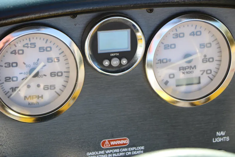 Slide: The Image of Dashboard of a 2006 Sea Ray 185 Sport boat with speedometer and RPM gauges. - 48