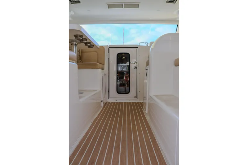 Slide: The Image of Interior view of 2017 Viking 37 Billfish boat with wooden flooring and seating. - 10