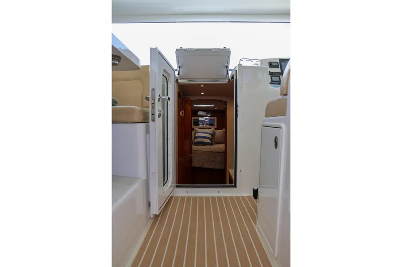 Slide: The Image of Interior view of 2017 Viking 37 Billfish yacht, featuring cabin entrance and seating. - 11