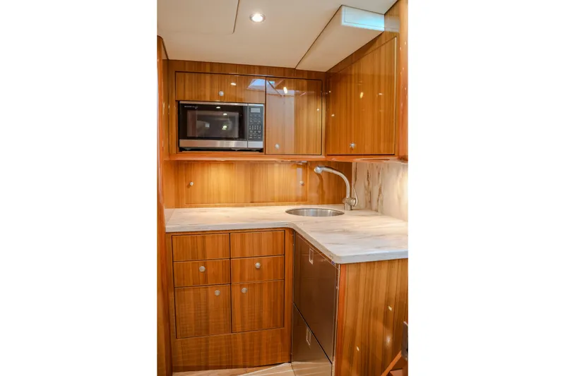 Slide: The Image of Luxurious wooden kitchenette in 2017 Viking 37 Billfish yacht with modern amenities. - 16