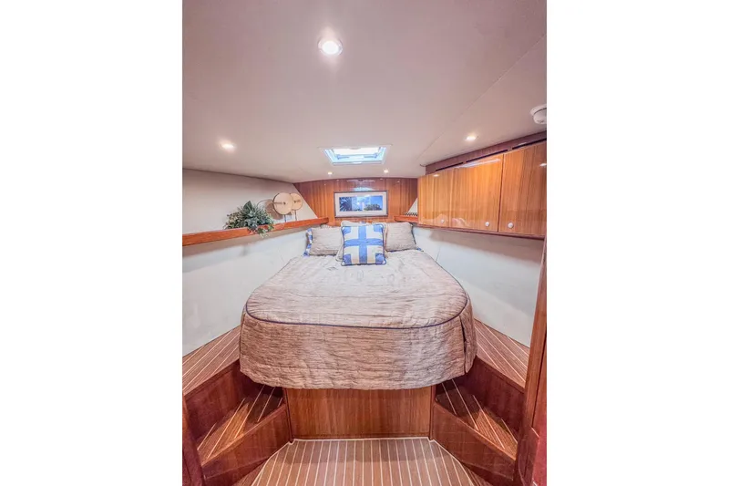 Slide: The Image of Luxurious cabin interior of 2017 Viking 37 Billfish yacht with cozy bed and wooden cabinetry. - 17