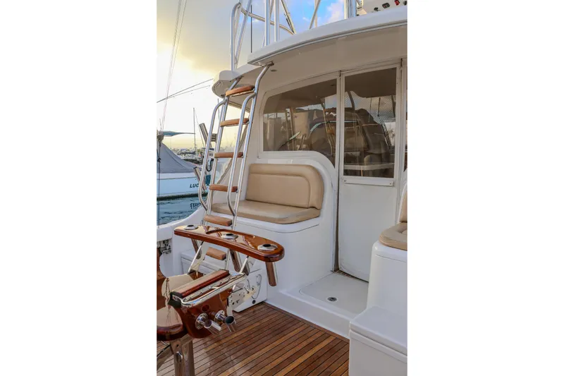 Slide: The Image of 2017 Viking 37 Billfish yacht with teak deck and cushioned seating area. - 2