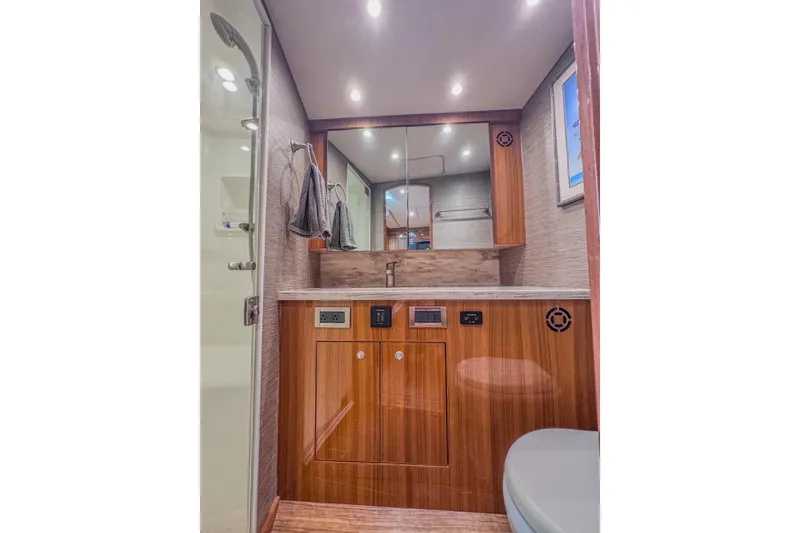 Slide: The Image of Luxurious bathroom interior of 2017 Viking 37 Billfish yacht with wooden cabinetry. - 20