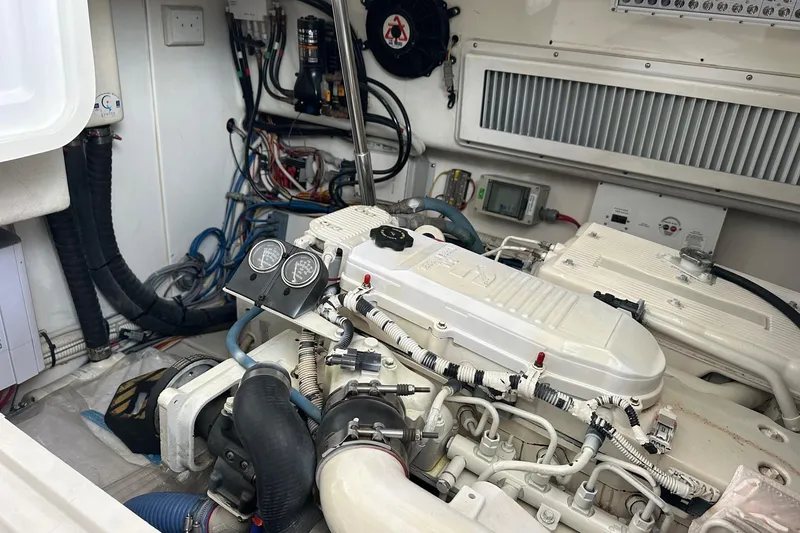 Slide: The Image of Engine room of a 2017 Viking 37 Billfish boat, showcasing detailed machinery and wiring. - 23