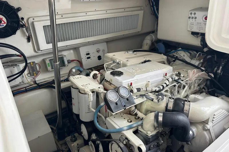 Slide: The Image of Engine compartment of a 2017 Viking 37 Billfish boat, showcasing detailed mechanical components. - 24