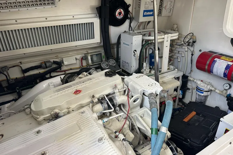 Slide: The Image of Engine room of a 2017 Viking 37 Billfish boat, showcasing mechanical components and systems. - 25
