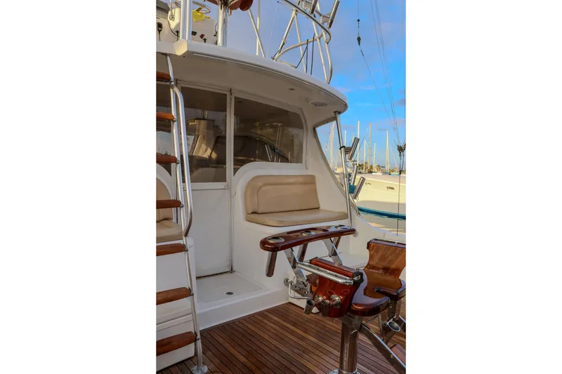 Slide: The Image of 2017 Viking 37 Billfish yacht cockpit with wooden deck and seating area. - 3